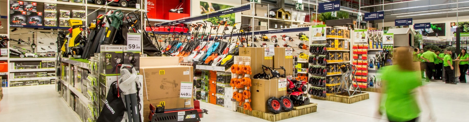 Interior of a Leroy Merlin store featuring aisles with gardening products, tools, and DIY equipment